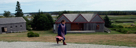 Young Girl walking through the Historic Acadian Village in Pubnico